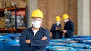 Industrial workers with face masks