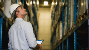 Man in warehouse w/ tablet