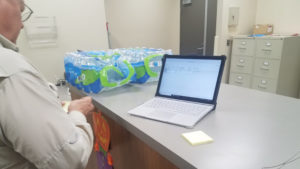 Grand Prairie technician using Surface Pro to view tickets in CMMS