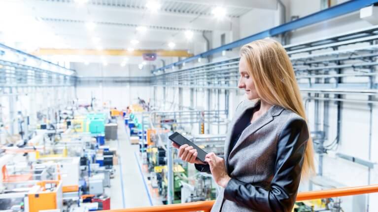 Worker on platform in factory