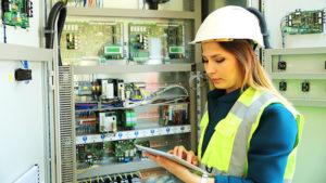 Maintenance worker analyzing machines