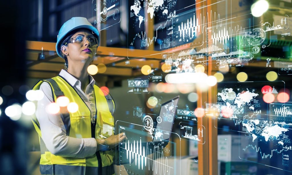 Woman in warehouse with PF Cruve being displayed in background