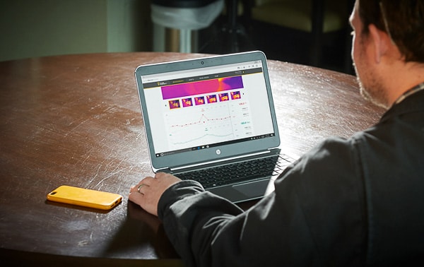 man looks at thermal data as part of a preventive maintenance plan.