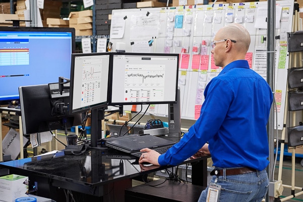 Technician looks at data from thermal and other sensors.