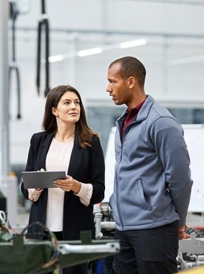 Woman and man discussing an Asset Criticality Assessment 